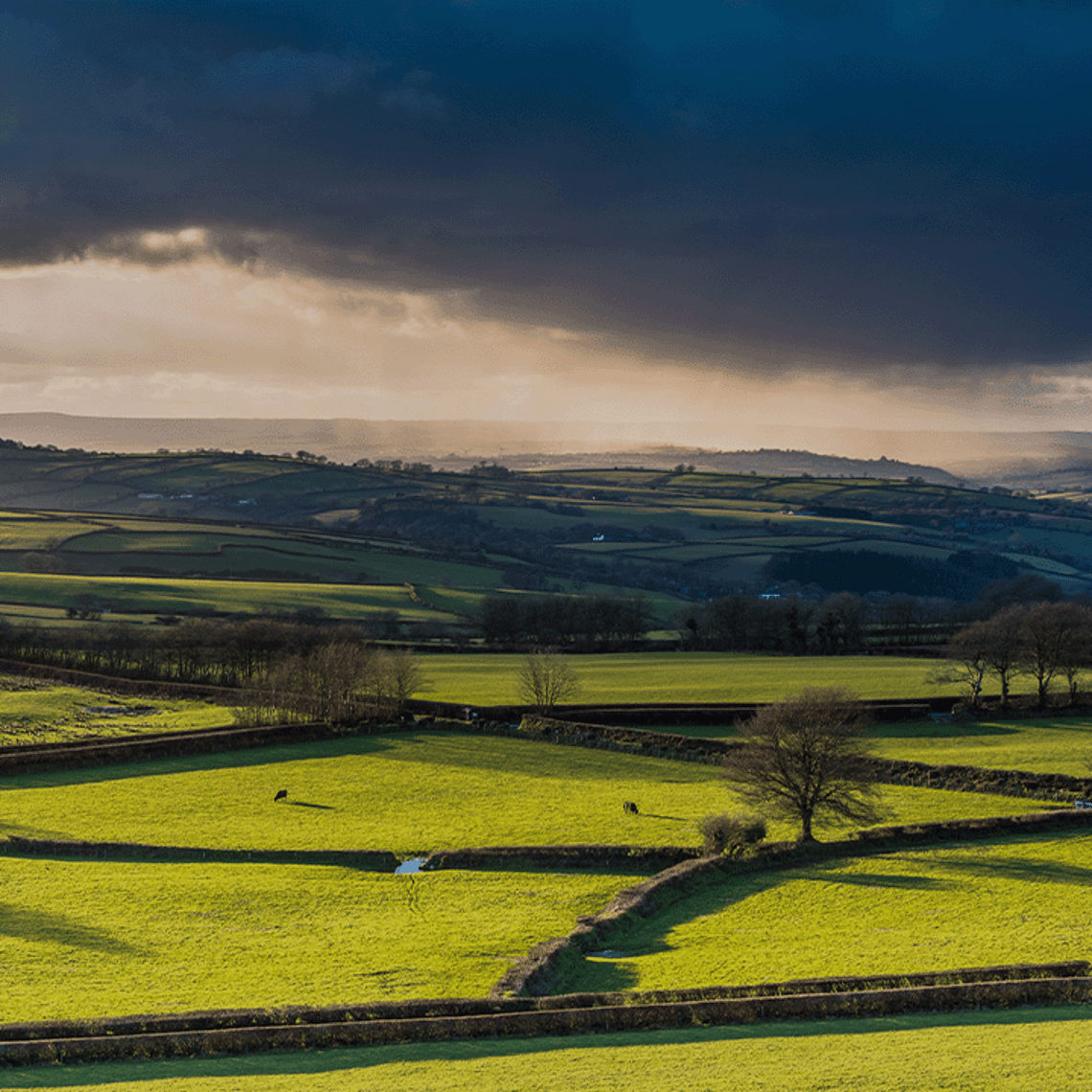 Picture of a dark storm over some hills 