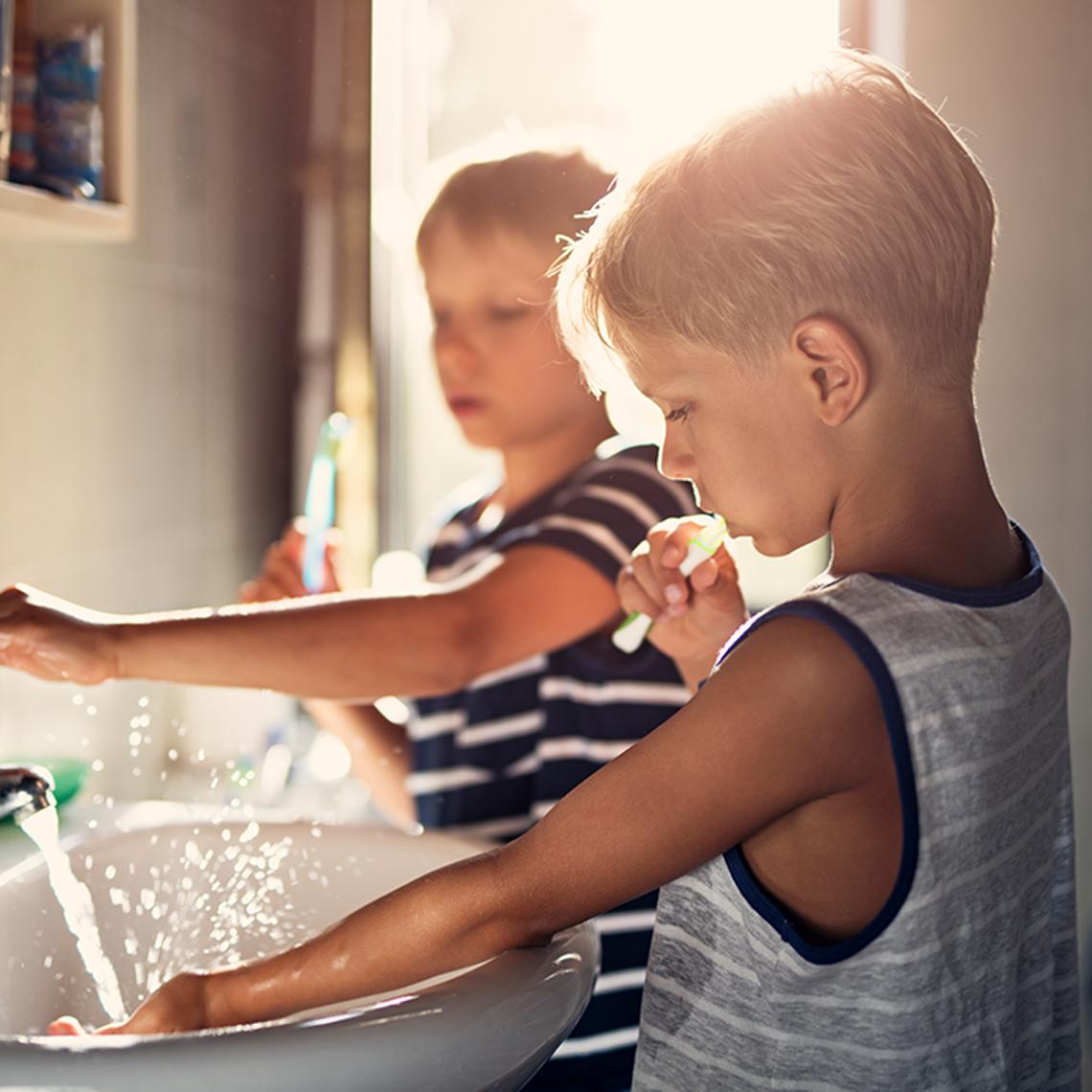 child brushing teeth
