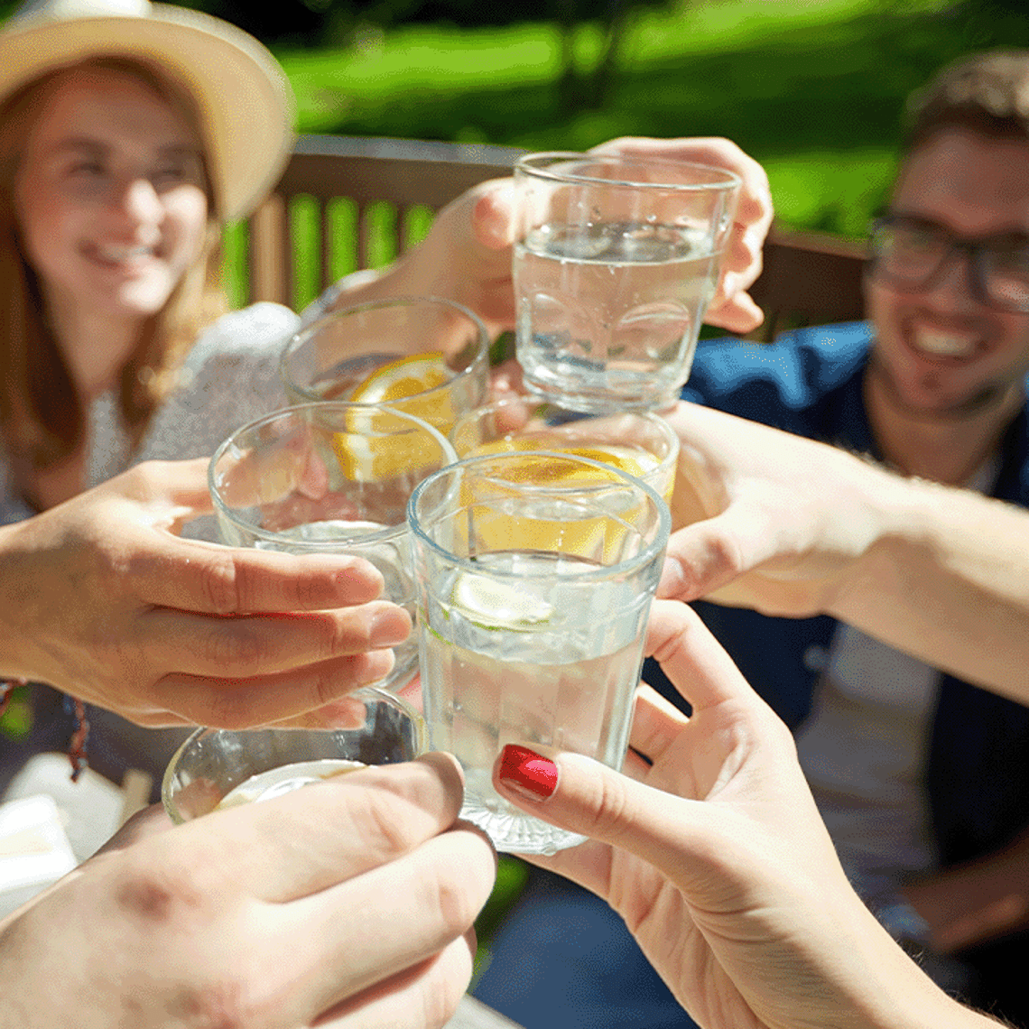 Friends raising a glass of water 