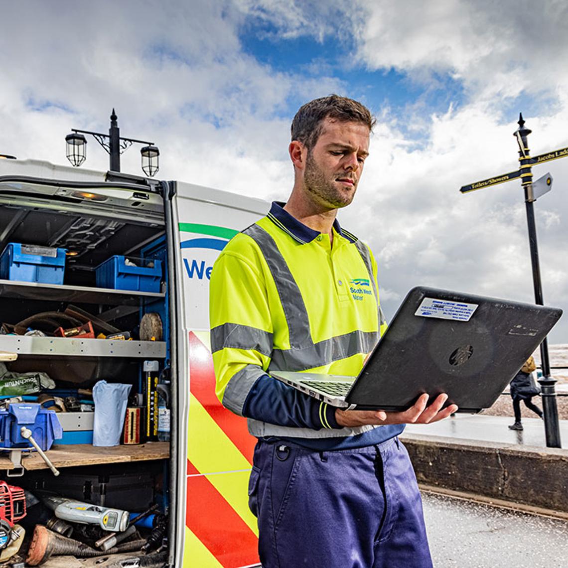 South West Water workman on laptop