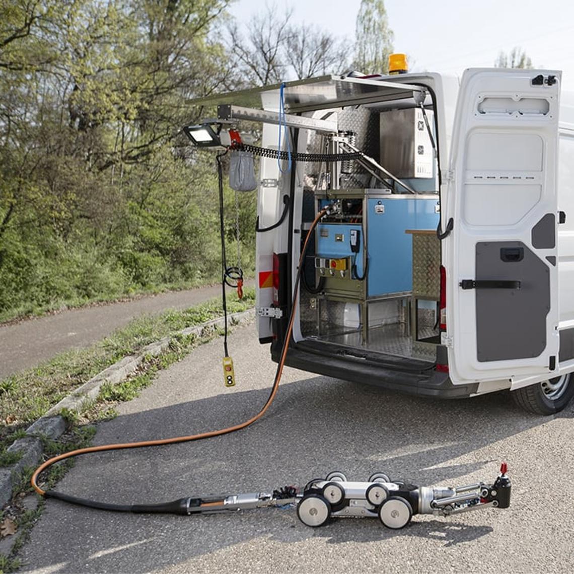 UV light robot on the road plugged in to a van