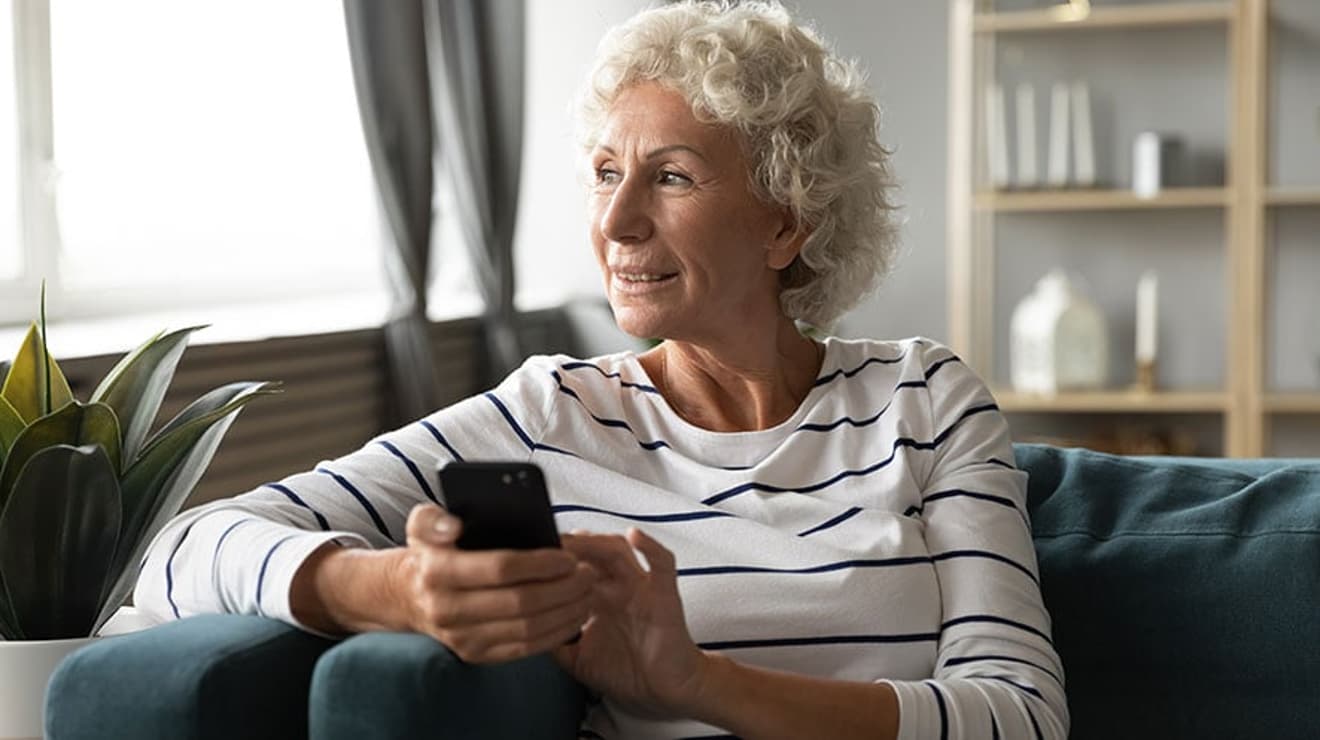 Lady on the phone smiling