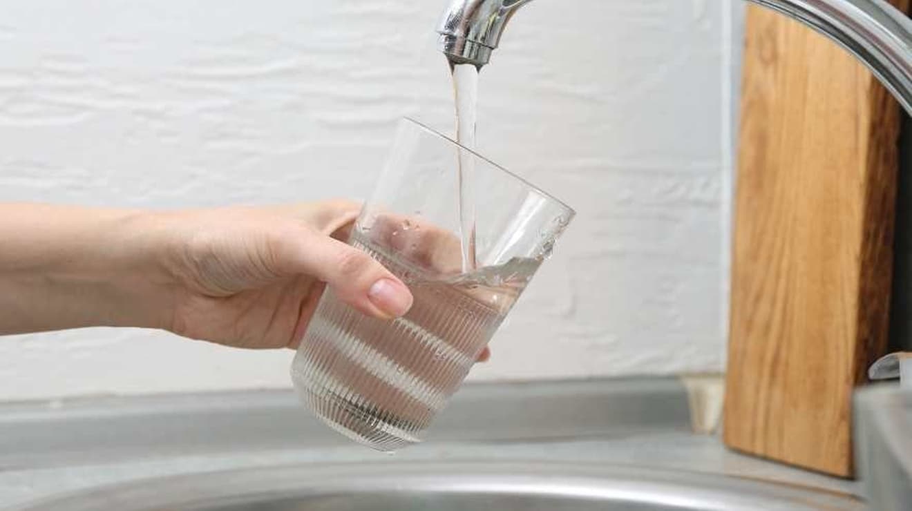 glass being filled with tap water