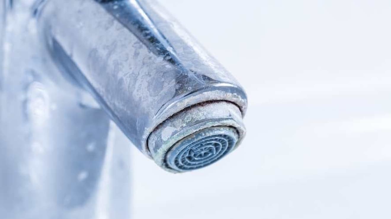 limescale around a chrome tap