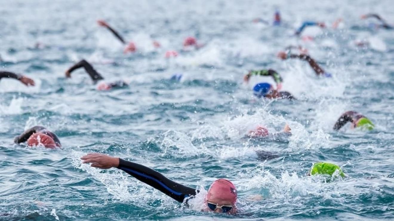 Many swimmers taking part in a sea swim