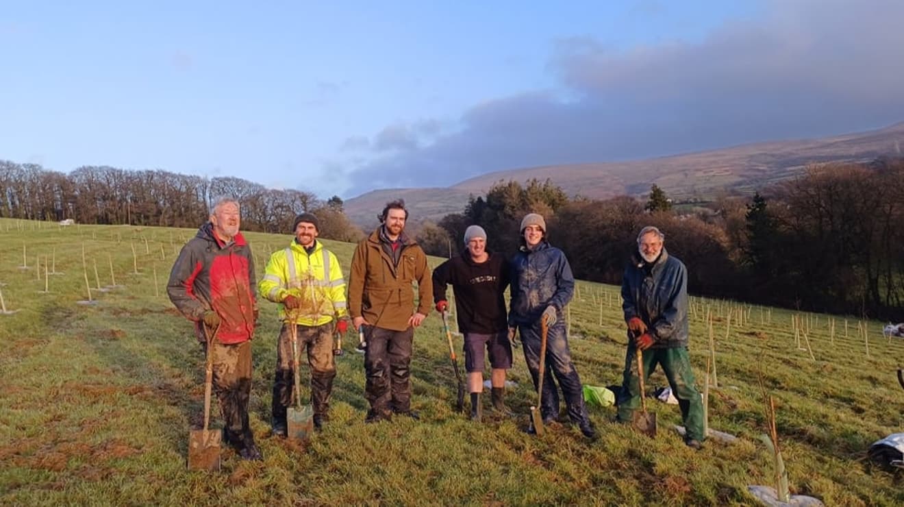 Group of volunteers with spades