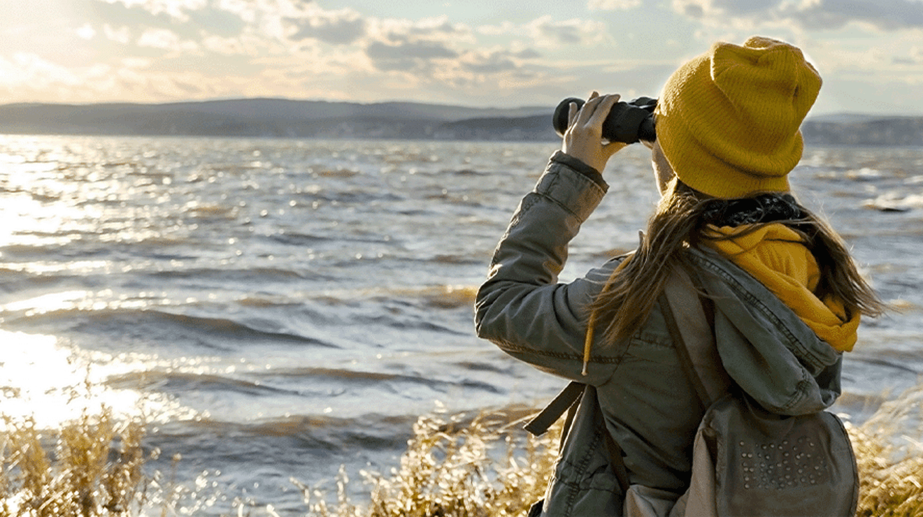 Lady looking through binoculars