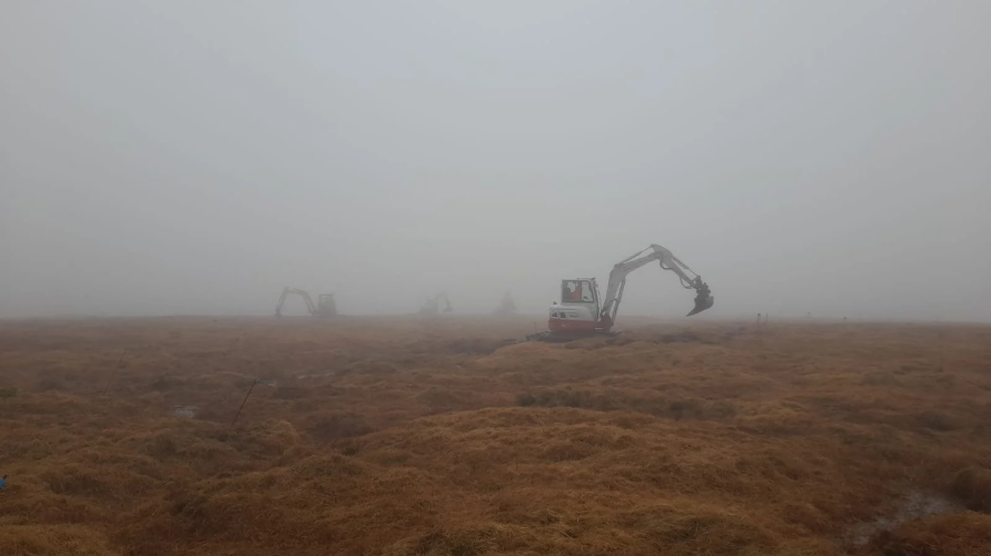 Diggers on a moor restoring Dartmoor's peatland