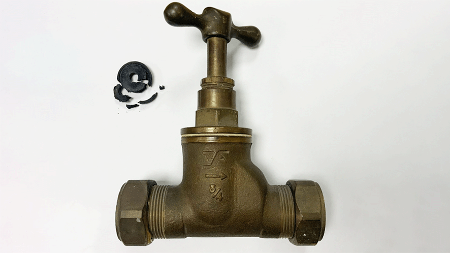 Stop tap with rubber washer in poor condition.