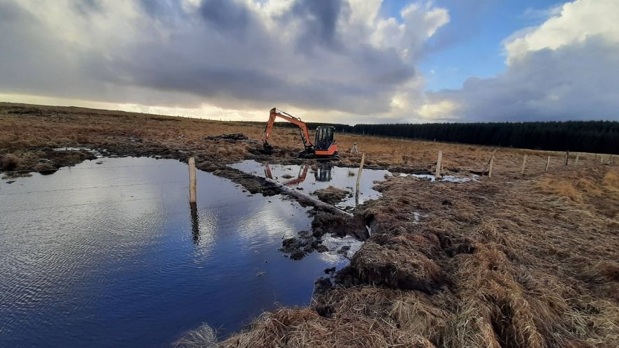digger working by the waterside