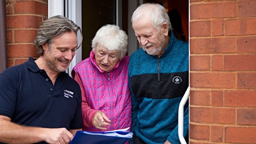 South West Water rep speaking to an elderly couple at their front door