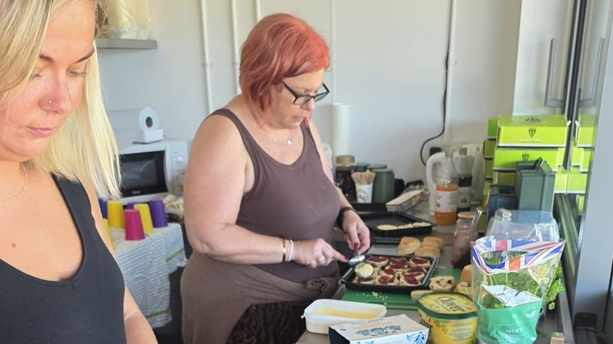 Women cooking in community kitchen