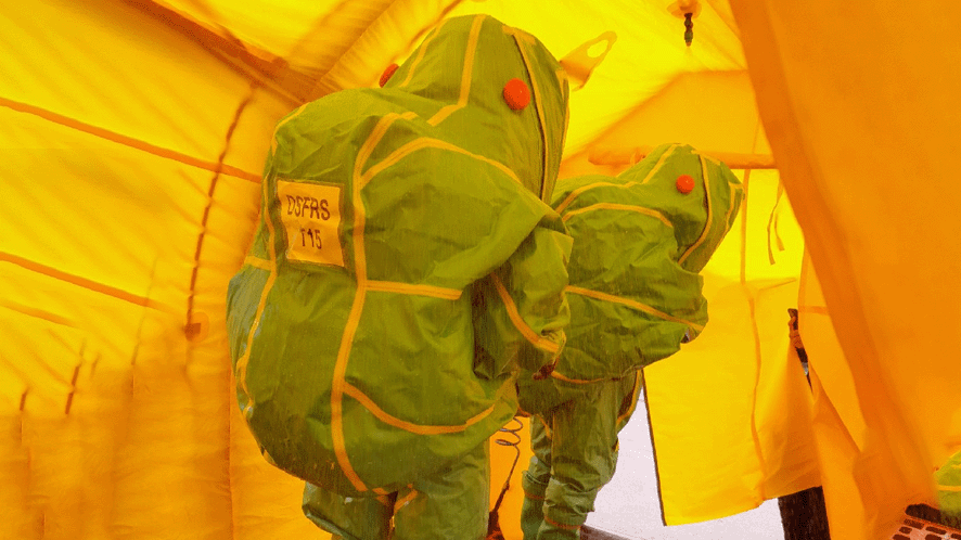2 people in gas tight suits