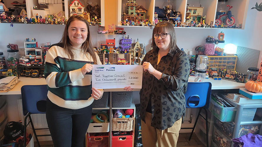 2 women from a local charity holding a cheque for £2000 form south west water