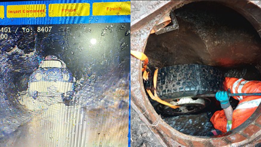 Image or a toy car and a tyre down a drain pipe