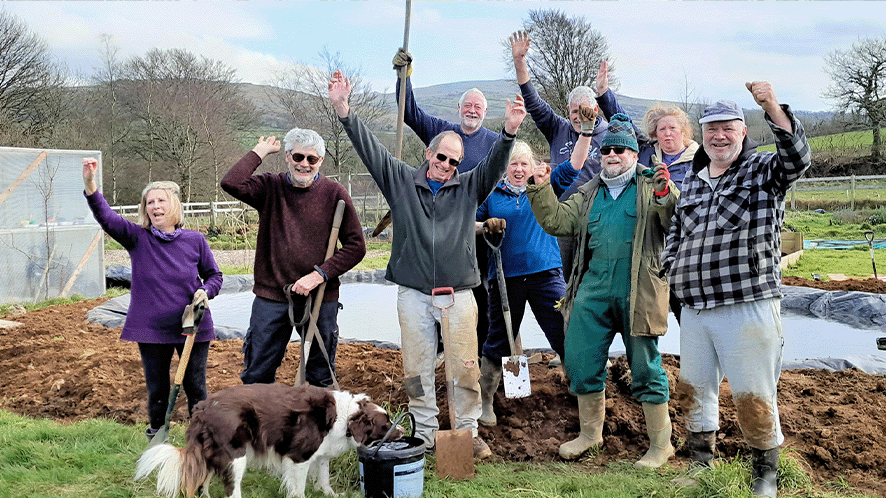 Group of gardeners looking very happy due to the water saving community fund  