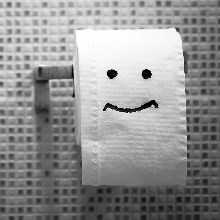 Toilet roll with a smiley face on it